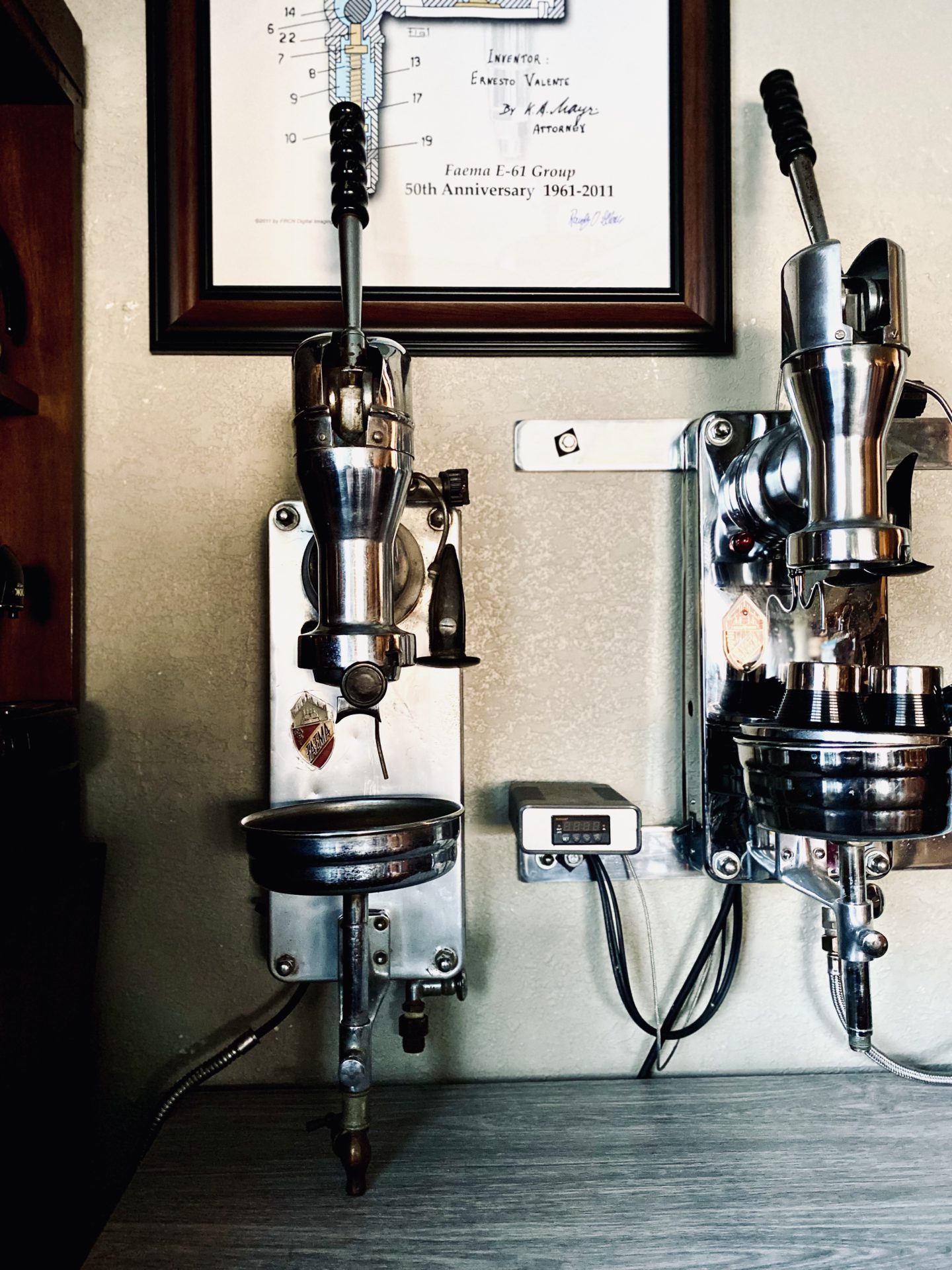Old Fashioned Espresso Machine With Two Cups Of Coffee by Stocksy  Contributor Aleksandar Novoselski - Stocksy